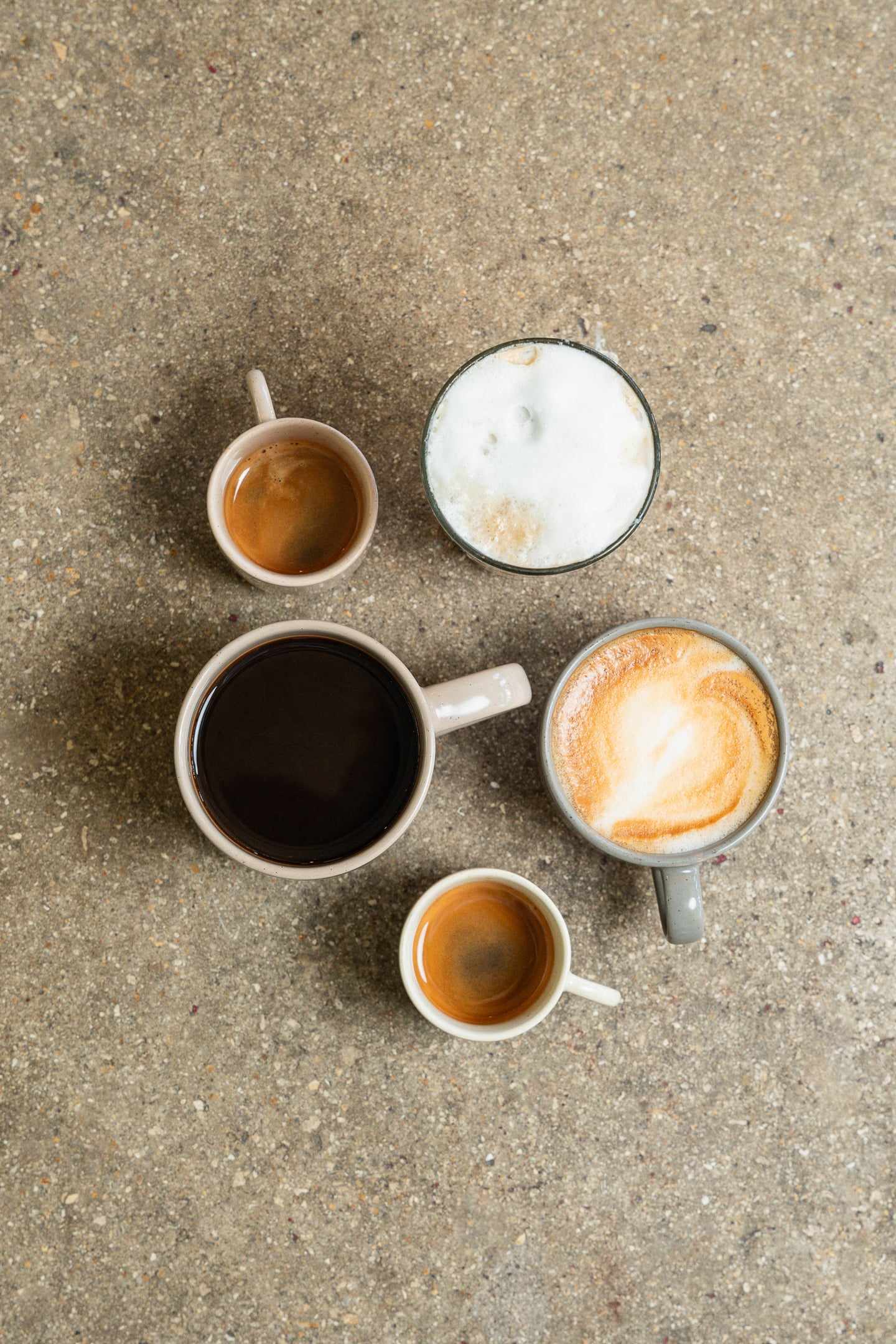 Espresso, americano, cappuccino and latte seen from above